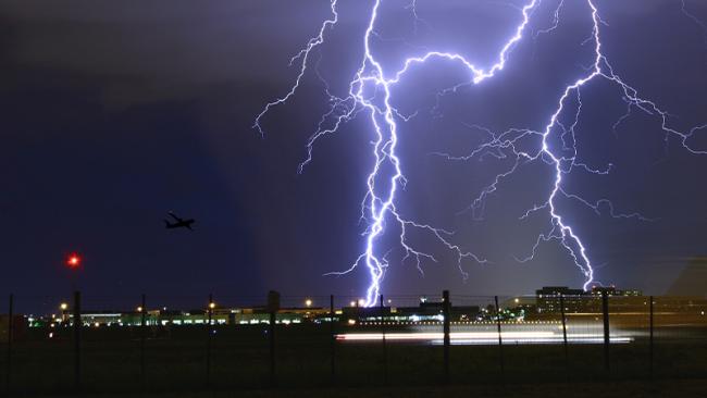 Night time lightning storm over an airport.