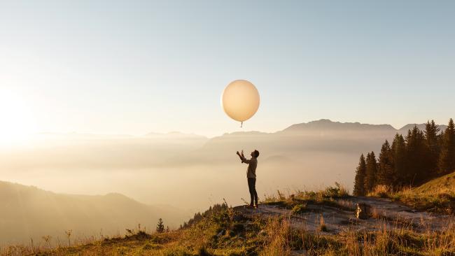 A man sending a weather balloon with a radiosonde
