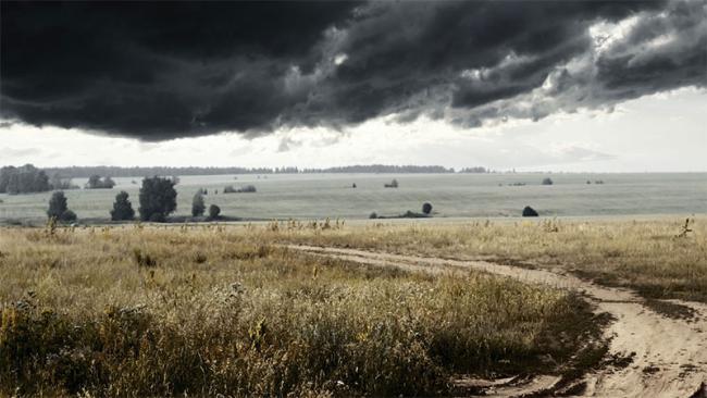 Dark clouds over a field