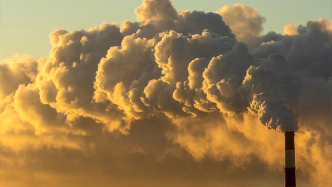Air pollution clouds from factory chimney