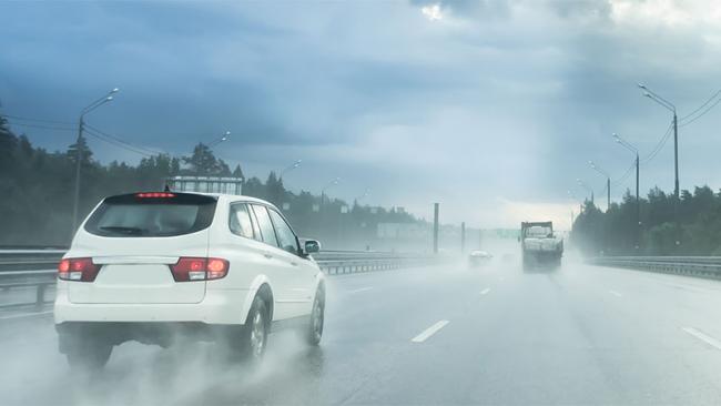 White car on a rainy road