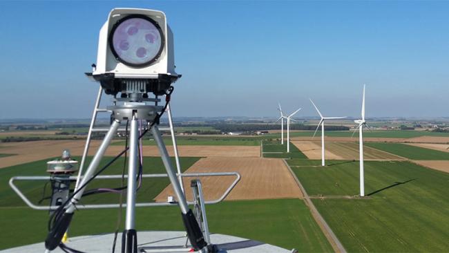 WindCube Nacelle with wind turbines in the background