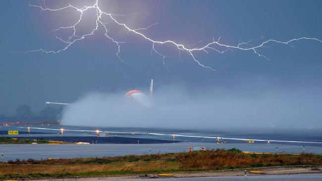 Plane taking off in a thunderstorm