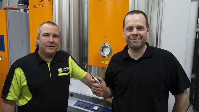 Entrepreneur Markus Wickholm from MaWi Automation Oy and Antti Heikkilä, Technical Manager from Eino Korhonen Oy, holding Vaisala’s DMT143 dew point transmitter.