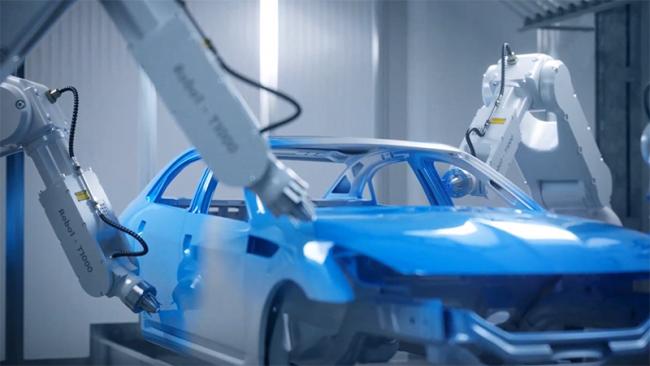 Robot arms painting a car