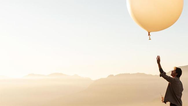 Man releasing weather balloon