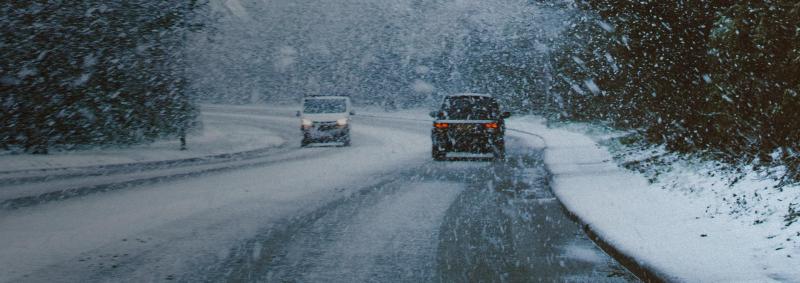 Cars driving on winter road