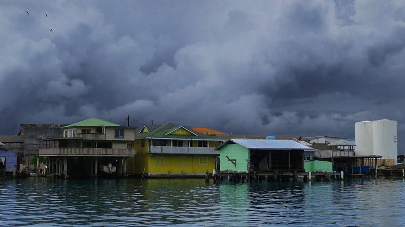 Stormy clouds over a waterside town