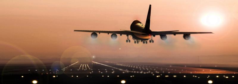 Airplane landing on dark runway