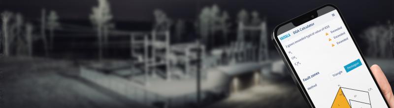 DGA Calculator on a phone, Power Substation at the background