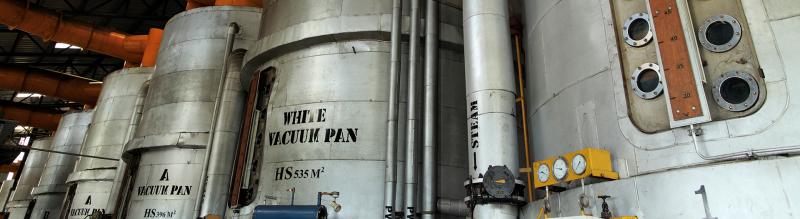 Vacuum pan processing equipment in a modern sugar mill factory