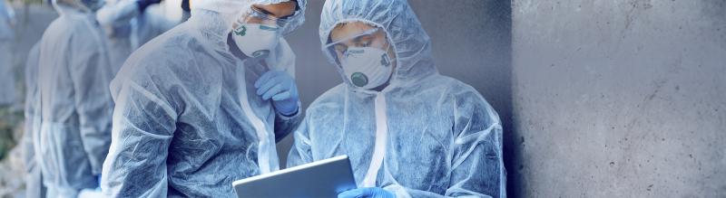 Healthcare workers wearing hazmat suits