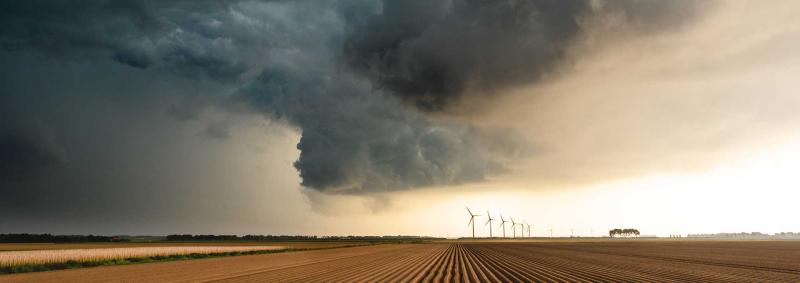 Dark clouds over a field