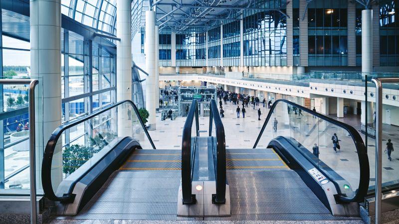 airport entry hall with escalators