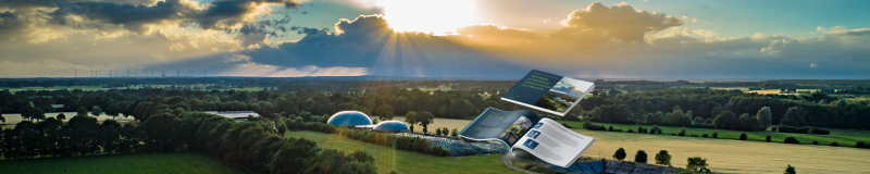 Biogas plant, sunset, book with cover and open pages