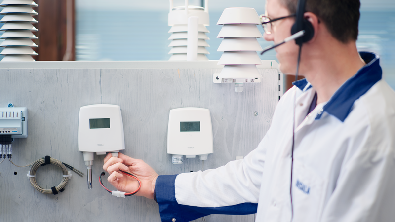 Technical support personnel checking probe