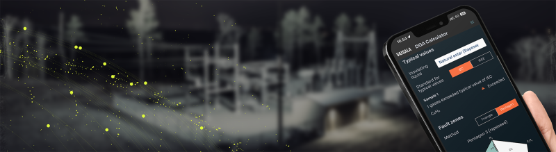 DGA Calculator on a phone, Power Substation at the background