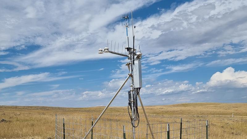 QTS100AAS pictured in a field with blue sky and clouds.