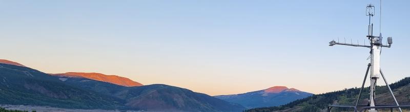 Quanterra Ecosystem Monitoring system with mountains in the background.