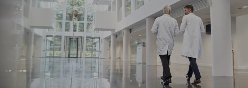 Doctors walking in hospital corridor