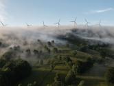 Wind turbines on a foggy field