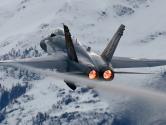 Fighter jet with snowy mountains in background