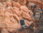 Soldier working on laptop