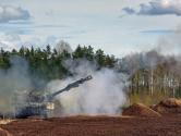 Latvian self propelled howitzer firing in the smoke