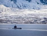Military submarine by a snowy coast