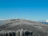 Wind turbines on snow covered ridge