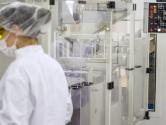Pharmaceuticals production line workers