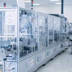 man walking pharmaceutical laboratory cleanroom