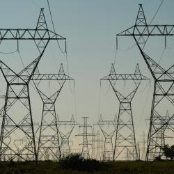 Power Grid Towers and Power Lines against a dusk sky