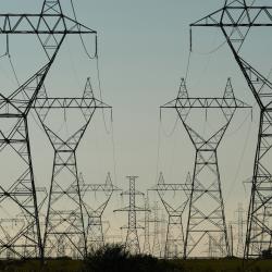 Power Grid Towers and Power Lines against a dusk sky