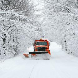 Snowplow clearing road
