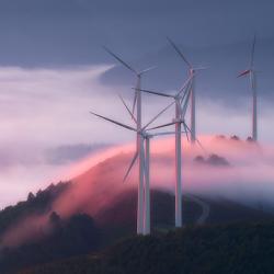 Wind turbines on a misty hill