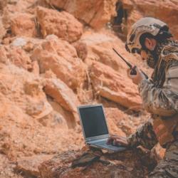 Soldier working on laptop