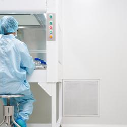 Laboratory worker in cleanroom.