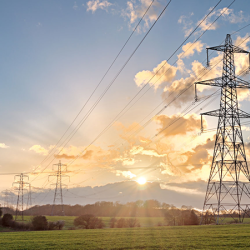 Power lines in a sunrise.