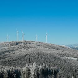 Wind turbines on snow covered ridge