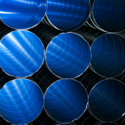 HVAC pipe ducting illuminated by blue light