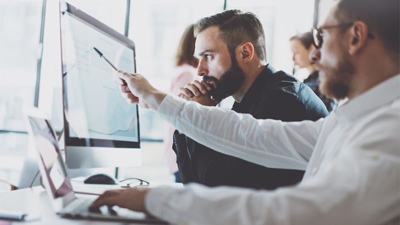 Men looking at monitor
