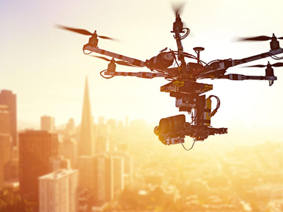 LIFT-SC-DroneWeather-Overview-667x500 Drone flying over skyscrapers in large urban city
