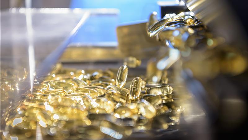 Medicine manufacturing, yellow capsules Medicine manufacturing, yellow capsules