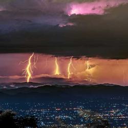 Lightning strikes over city